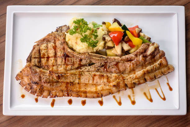 Grilled pork chop with mash potato and dressing
