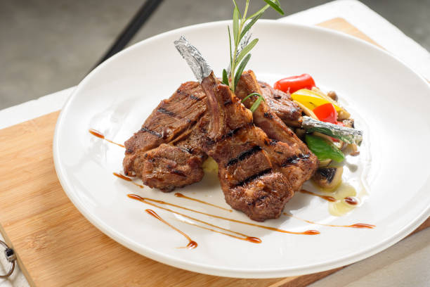 istock Grilled T bone steak with garnishing 1219929675