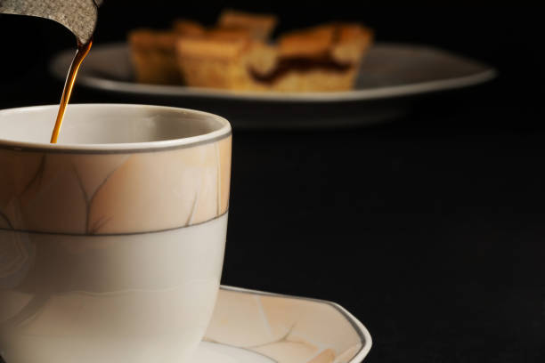 istock Cup of coffee filling with sweets background 1219929906
