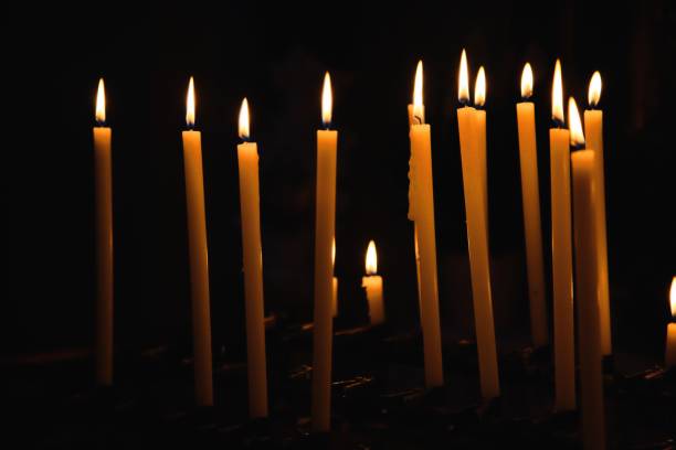istock Wax candles glowing in the dark 1219930559