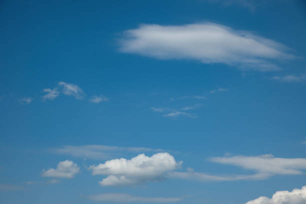 Texture of clouds against a blue sky Texture of clouds against a blue sky, dramatic background of a cloudy sky, background with a rich blue color, changes in the atmosphere movement of cyclones and air masses stratosphere meteorology climate air stock pictures, royalty-free photos & images