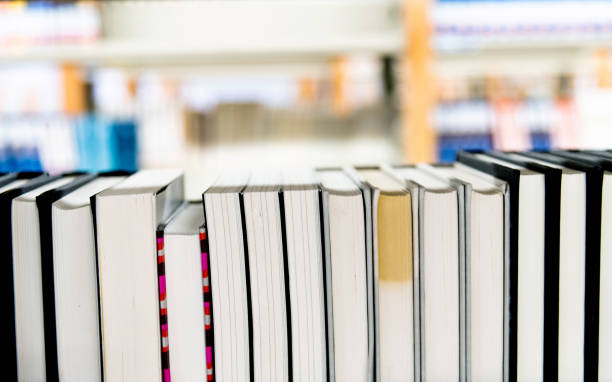 istock Close up of books in library bookshelf 1219931720