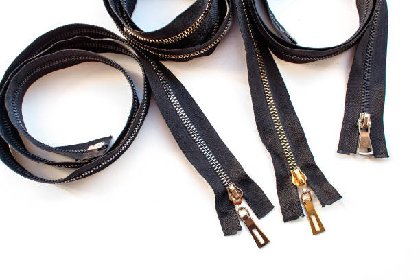istock three metal closed zippers closeup 1219932703