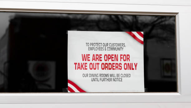istock Sign in window says to protect our customers from coronovirus 1219932949
