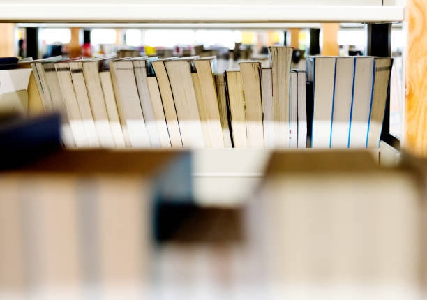 istock Close up of books in library bookshelf 1219933043