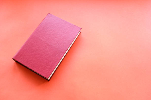 istock red book on a red background in hardcover 1219933334