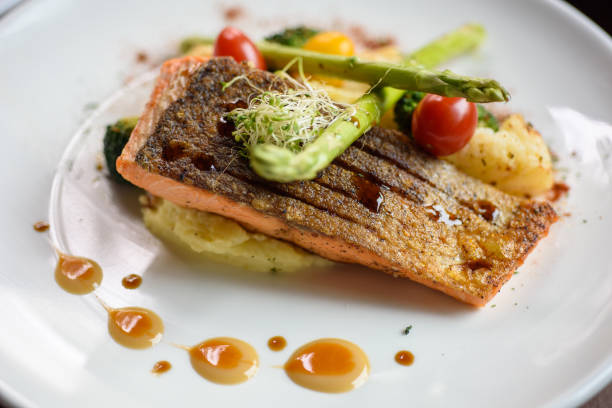 Grilled salmon topped with asparagus