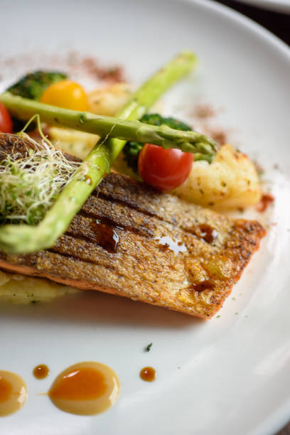 Grilled salmon topped with asparagus