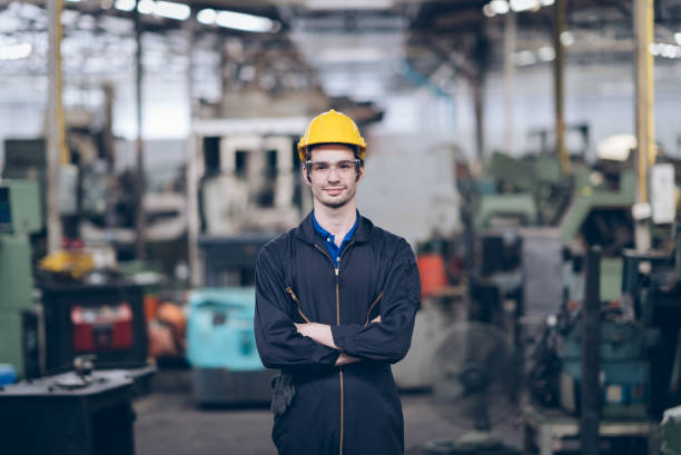 istock professional technician engineer standing  and arm cross in factory 1219936281
