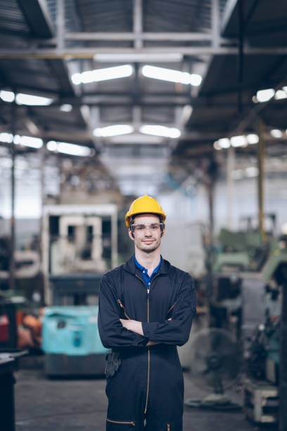 istock wroker technician engineer standing   in factory 1219936290