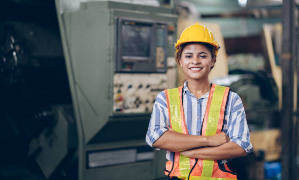 istock Smile technician engineer women  in factory 1219936382