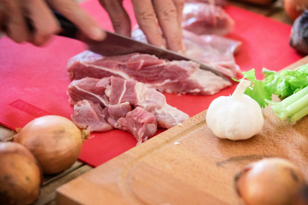 istock Hungarian goulash preparing, meat chopping, close-up 1219936583