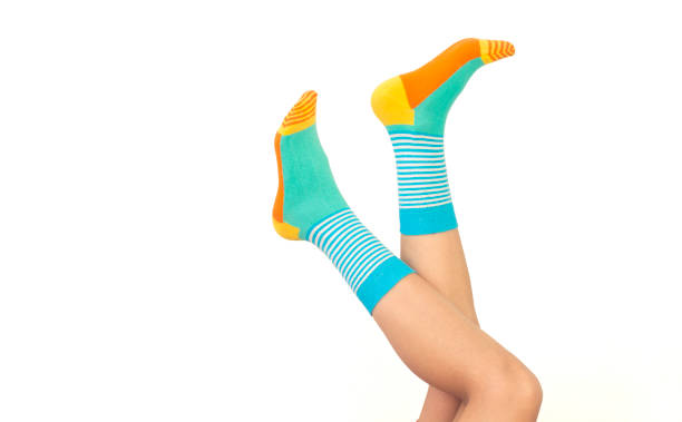 Woman in stylish socks on white background
