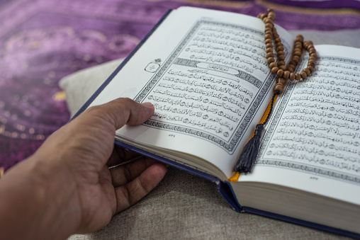Koran and beads on the prayer mat during Ramadan