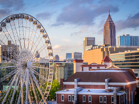 View of Atlanta, Georgia on a beautiful spring day with sunlight reflecting off the Ferris wheel in Downtown.