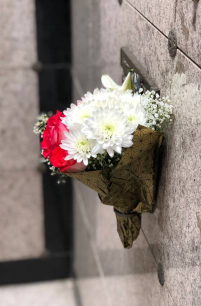 istock Flowers hanging on a mausoleum wall 1219938773