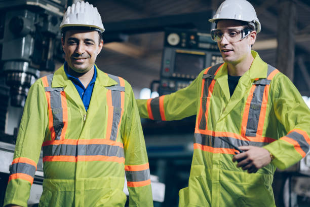 istock professional technician engineer with Operator Operating Industrial in factory 1219939271