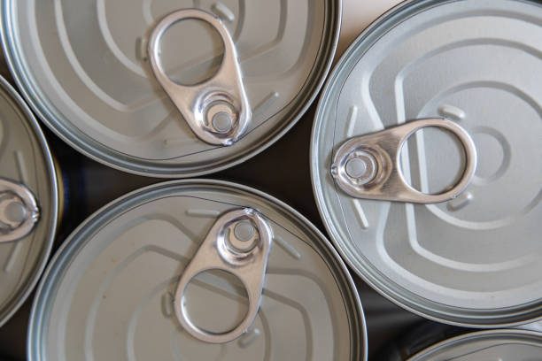 istock Lids of canned food background 1219940219