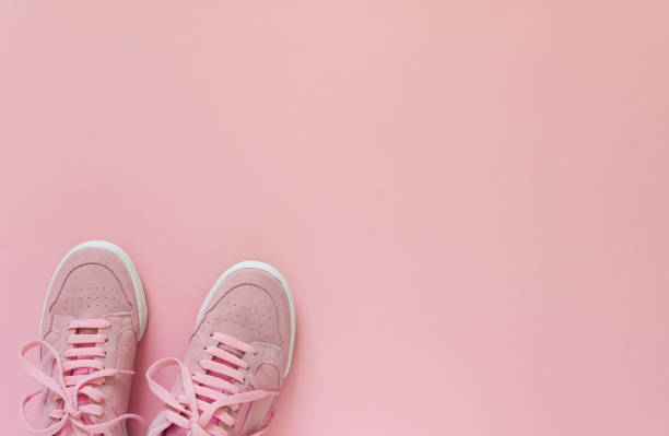 istock Pink sneakers isolated on a pink background 1219940278