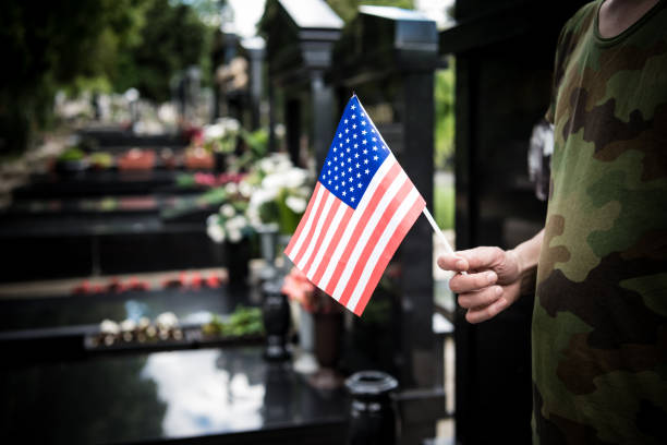 istock Soldier standing at cemetary- Coronavirus 1219940884