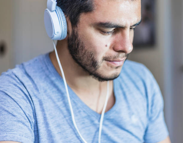 istock Men listening music with technology 1219940960