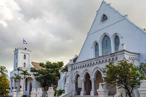Presbyterian Church and grounds with flog flying over its Bell Tower in Nassau, The Bahamas