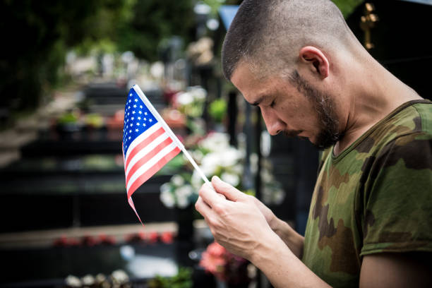 istock Soldier standing at cemetary- Coronavirus 1219942595
