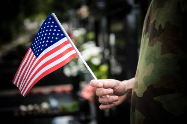 istock Soldier standing at cemetary- Coronavirus 1219942709