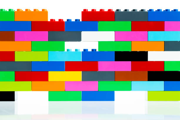 Wall made of plastic blocks on white background.
