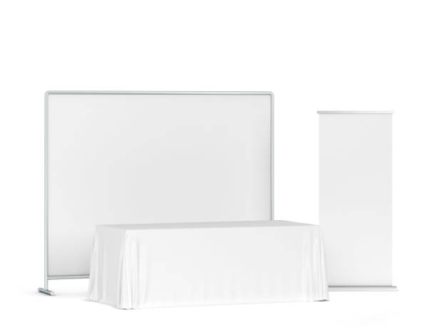 istock Blank tradeshow tablecloth with roll-up banners aside 1219943001