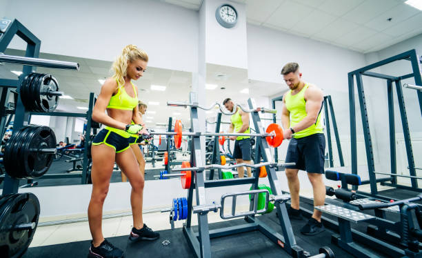 istock Trainer and client at the gym with sport equipment. 1219943294