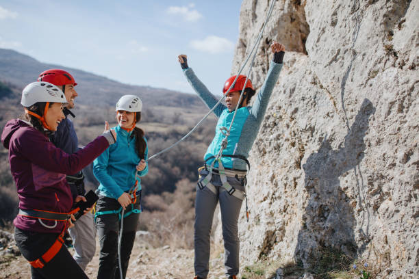 istock Woman climber celebrating success 1219945988