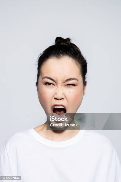 Headshot Of Angry Asian Young Woman Stock Photo - Download Image Now - Anger, Displeased, Females
