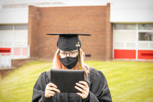 istock Social Distancing Graduate Outside 1219948106