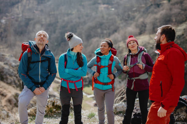 istock Climbing coach giving instruction about climbing safety 1219948121