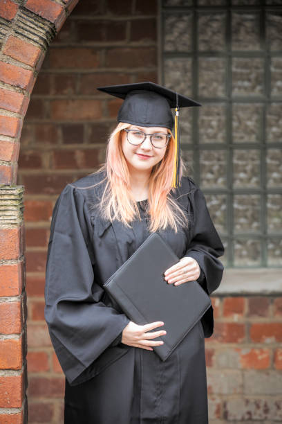 istock Beautiful Graduate Holding Diploma 1219948149