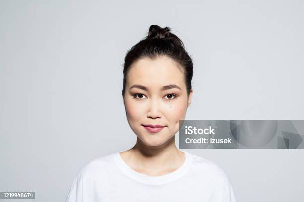Headshot Of Friendly Asian Young Woman Stock Photo - Download Image Now - One Woman Only, Women, Smirking