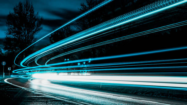 istock blue car lights at night. long exposure 1219949185
