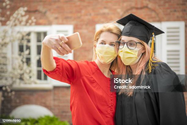 Pandemic Grad Mother And Daughter Selfie Stock Photo - Download Image Now - Graduation, Parent, Protective Face Mask