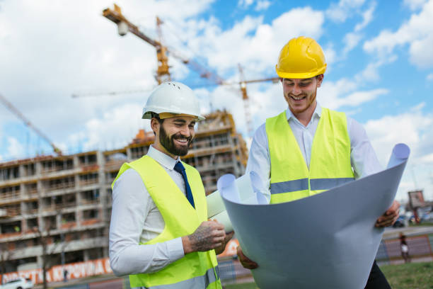 istock Engineer and contractor having brief meeting on construction site 1219951552