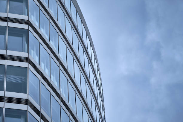 Close-up of facade of office building Close-up of the facade of a office building with modern architecure with glass and metal. Seen in Germany in May. architecture textured effect architectural feature business stock pictures, royalty-free photos & images