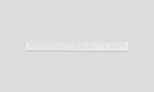 Blank white knitted unfolded soccer scarf mockup, gray background Blank white knitted unfolded soccer scarf mockup, gray background, 3d rendering. Empty stretching fan muffler for sport supporter mock up, top view. Clear accessory knitwear for team mokcup template. soccer scarf blank stock pictures, royalty-free photos & images