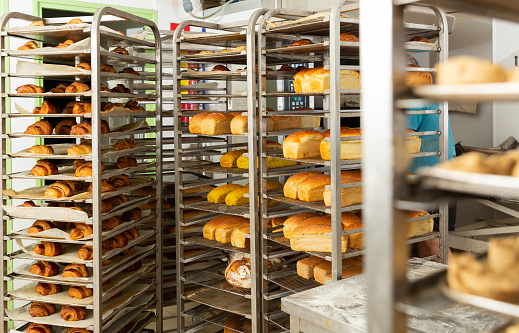 Freshly baked bread on racks in a bakery