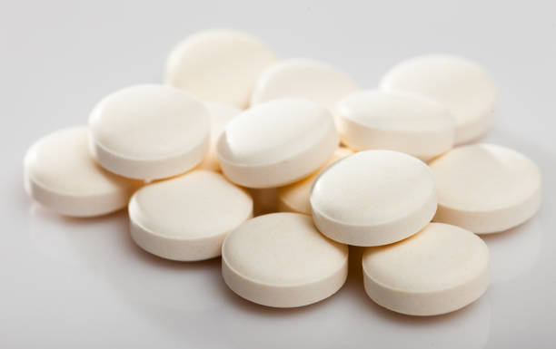 istock Many different pills and medical capsules close up 1219954083