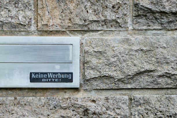 istock Silver mailbox in wall sign that says 