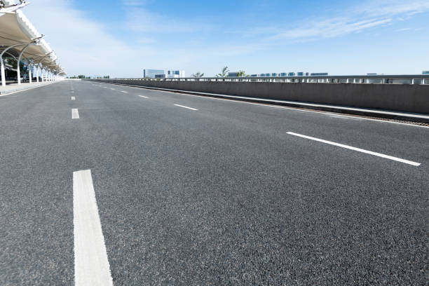 istock Empty asphalt road with buildings in the city 1219955029