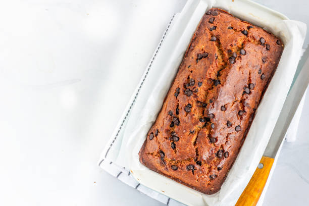 istock Freshly Baked Banana Bread on a Light Background with Chocolate Chips 1219956032