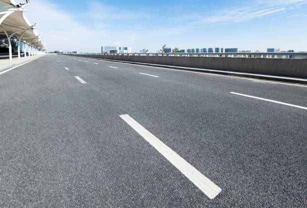 istock Empty asphalt road with buildings in the city 1219956033