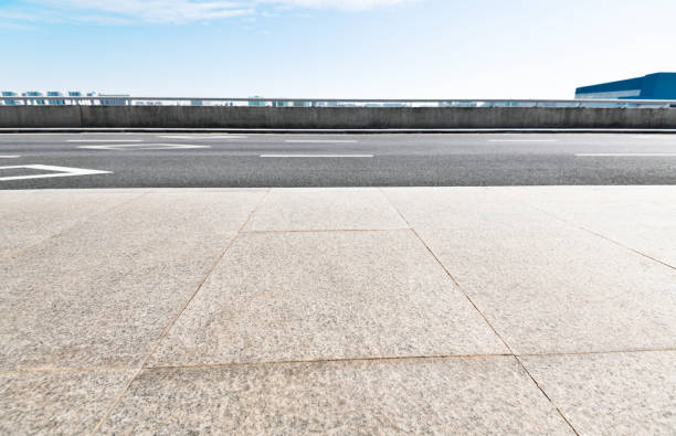 istock Empty asphalt road with buildings in the city 1219956829
