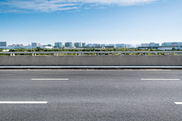 istock Empty asphalt road with buildings in the city 1219956831